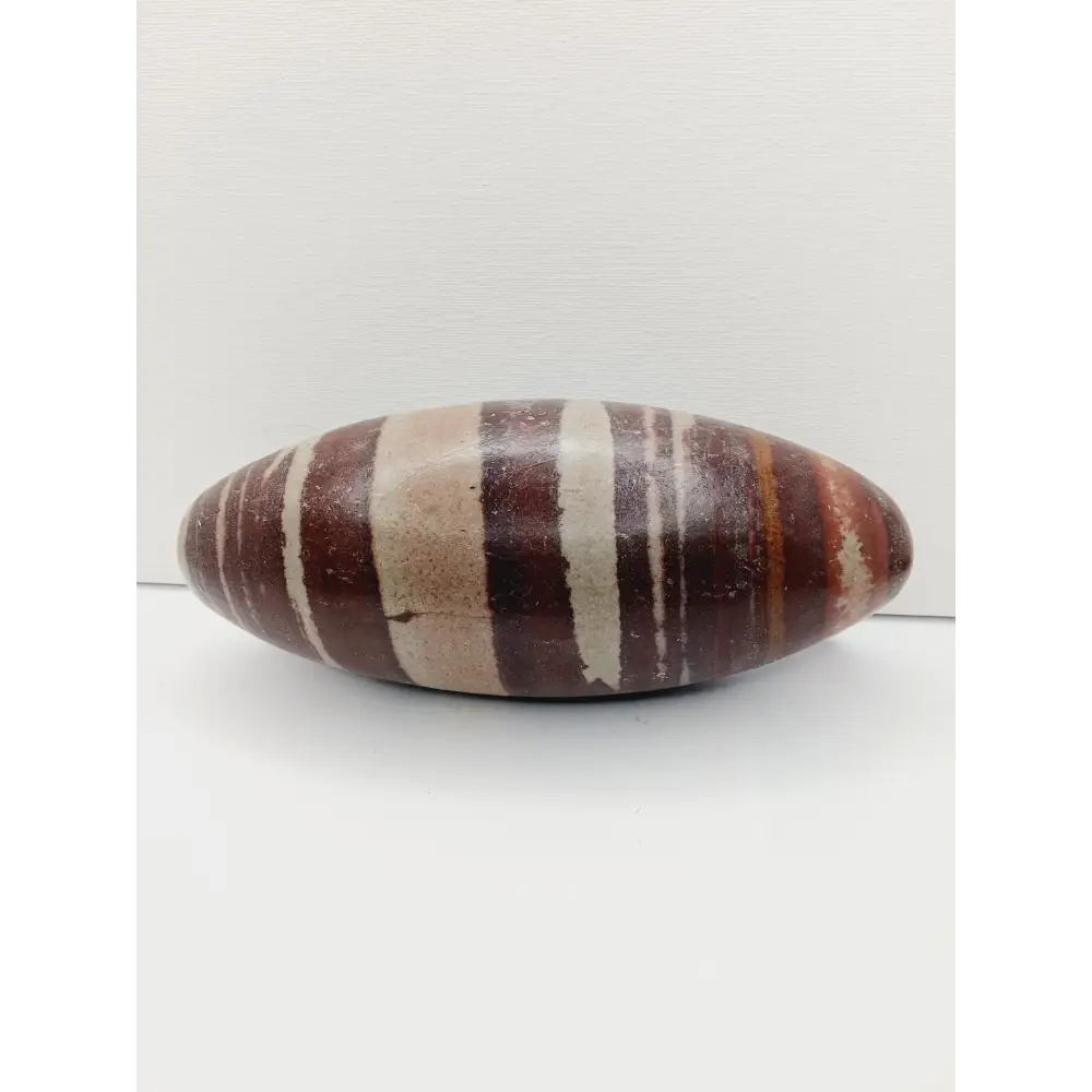 Shiva Lingam stones, polished with natural earthy patterns, available in sizes 1