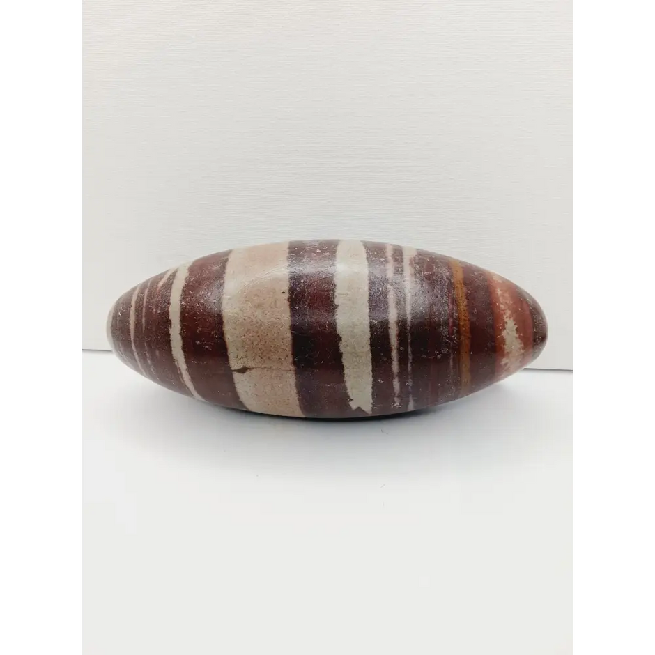 Shiva Lingam stones, polished with natural earthy patterns, available in sizes 1