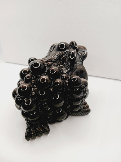 Silver sheen obsidian money toad, hand-carved with a reflective silver luster, measuring 5.5 inches, displayed on a white background.