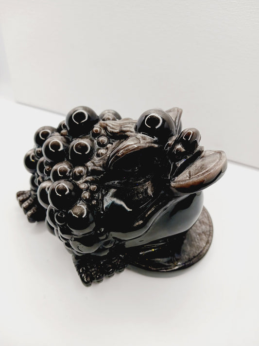 Silver sheen obsidian money toad, hand-carved with a reflective silver luster, measuring 5.5 inches, displayed on a white background.