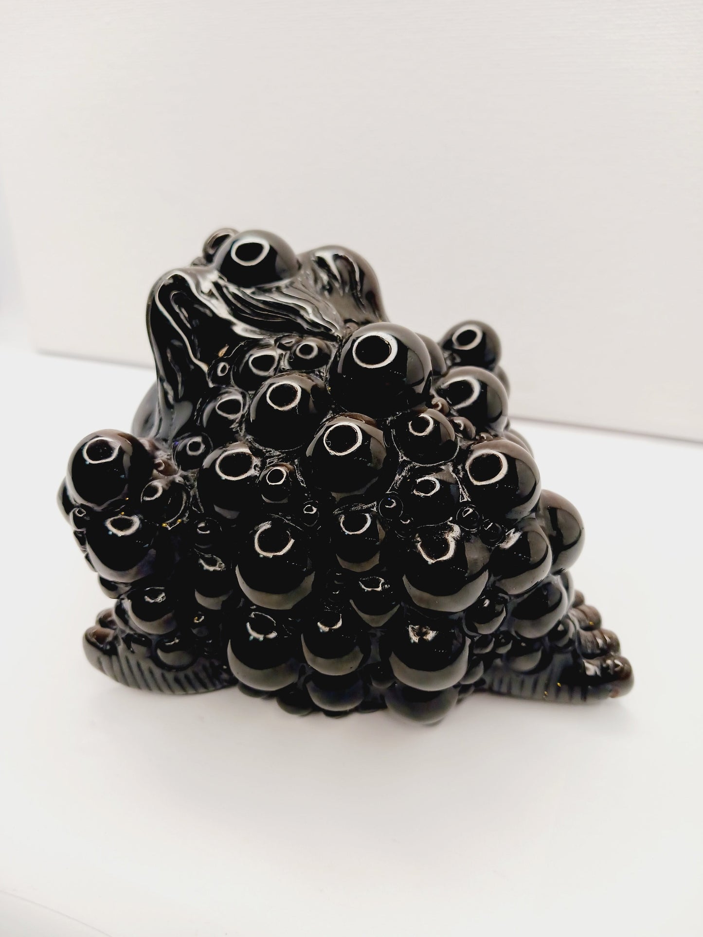 Silver sheen obsidian money toad, hand-carved with a reflective silver luster, measuring 5.5 inches, displayed on a white background.