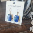 Sterling silver earrings featuring vibrant blue azurite stones, displayed on a white background. Perfect for insight, intuition, and vibrant energy.