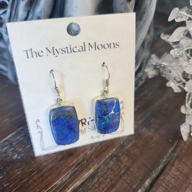 Sterling silver earrings featuring vibrant blue azurite stones, displayed on a white background. Perfect for insight, intuition, and vibrant energy.
