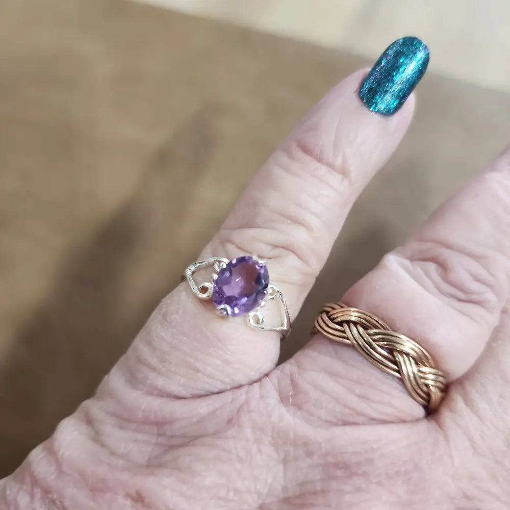 Assorted sterling silver rings featuring unique genuine gemstones in various shapes and colors, displayed on a white background. Perfect for crystal energy, personal style, and one-of-a-kind magic.