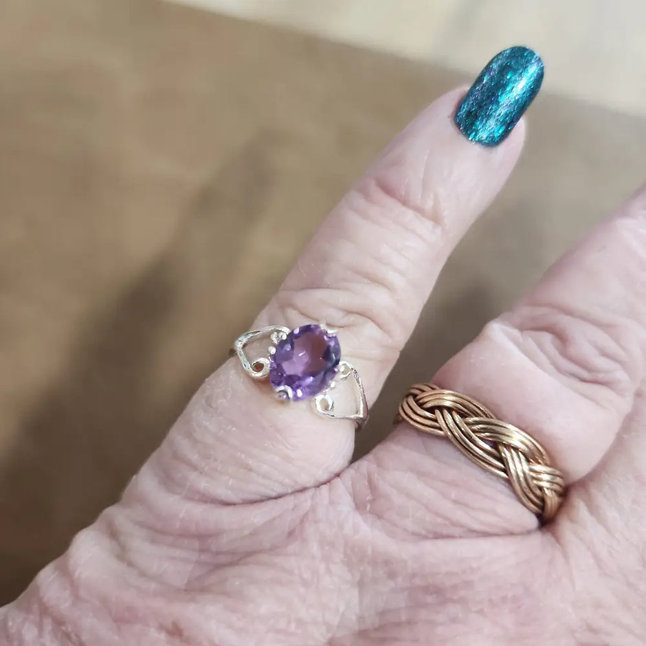 Assorted sterling silver rings featuring unique genuine gemstones in various shapes and colors, displayed on a white background. Perfect for crystal energy, personal style, and one-of-a-kind magic.