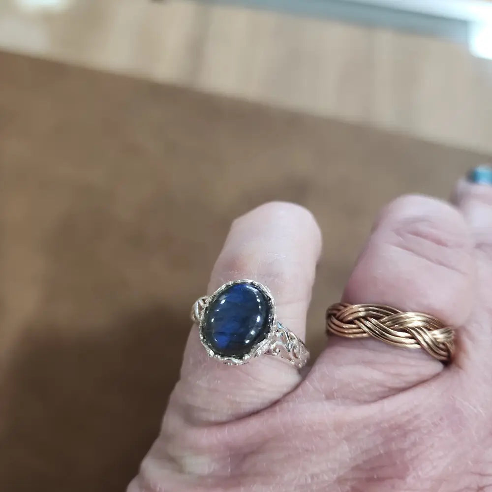 Assorted sterling silver rings featuring unique genuine gemstones in various shapes and colors, displayed on a white background. Perfect for crystal energy, personal style, and one-of-a-kind magic.