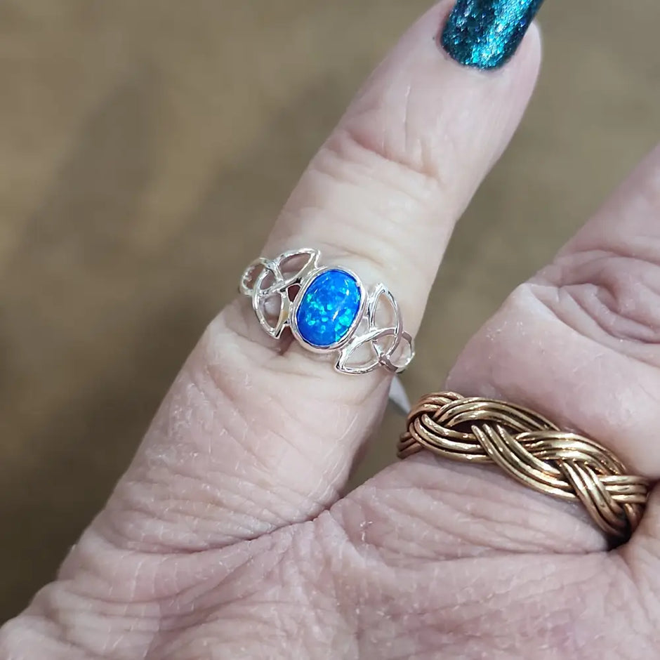 Assorted sterling silver rings featuring unique genuine gemstones in various shapes and colors, displayed on a white background. Perfect for crystal energy, personal style, and one-of-a-kind magic.