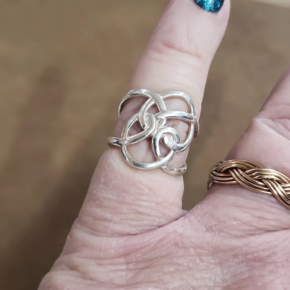 Assorted sterling silver rings featuring unique genuine gemstones in various shapes and colors, displayed on a white background. Perfect for crystal energy, personal style, and one-of-a-kind magic.