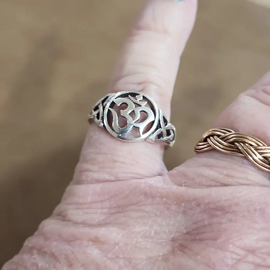 Assorted sterling silver rings featuring unique genuine gemstones in various shapes and colors, displayed on a white background. Perfect for crystal energy, personal style, and one-of-a-kind magic.