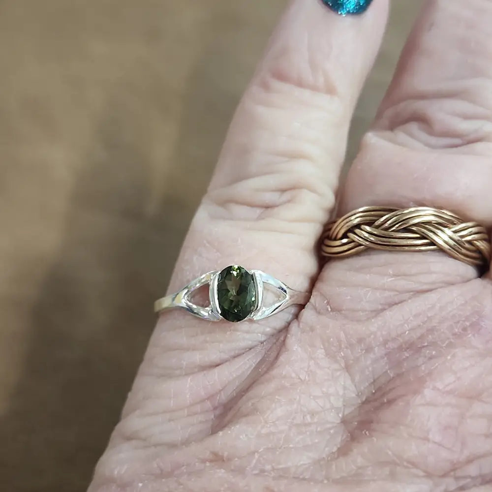 Assorted sterling silver rings featuring unique genuine gemstones in various shapes and colors, displayed on a white background. Perfect for crystal energy, personal style, and one-of-a-kind magic.