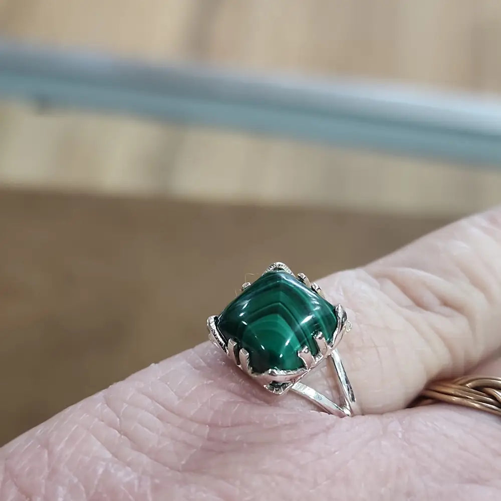 Assorted sterling silver rings featuring unique genuine gemstones in various shapes and colors, displayed on a white background. Perfect for crystal energy, personal style, and one-of-a-kind magic.
