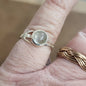 Assorted sterling silver rings featuring unique genuine gemstones in various shapes and colors, displayed on a white background. Perfect for crystal energy, personal style, and one-of-a-kind magic.