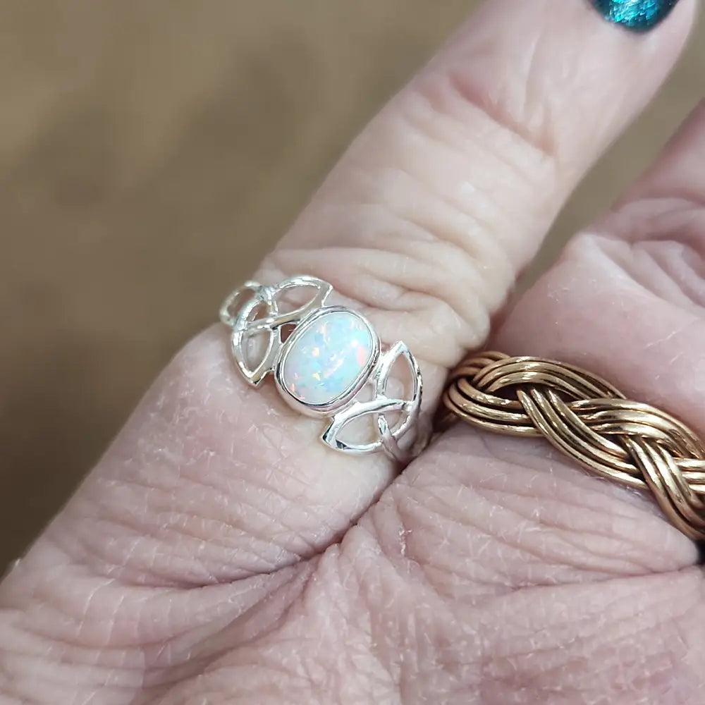 Assorted sterling silver rings featuring unique genuine gemstones in various shapes and colors, displayed on a white background. Perfect for crystal energy, personal style, and one-of-a-kind magic.