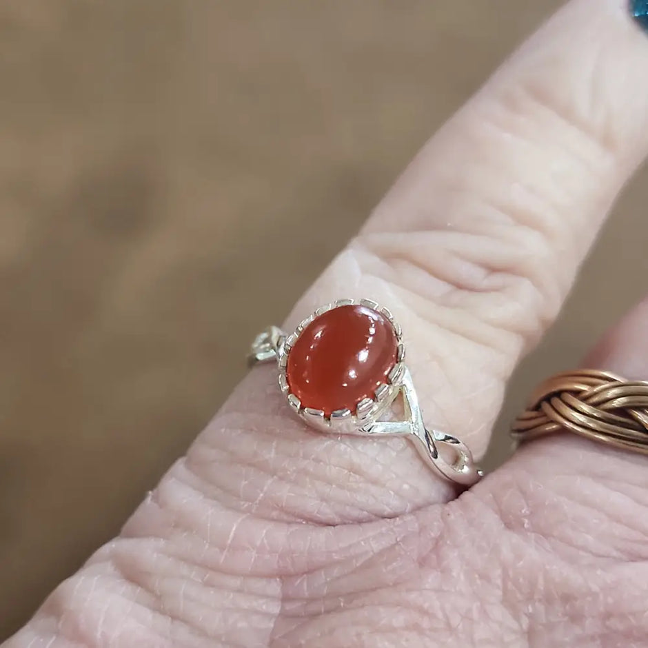 Assorted sterling silver rings featuring unique genuine gemstones in various shapes and colors, displayed on a white background. Perfect for crystal energy, personal style, and one-of-a-kind magic.