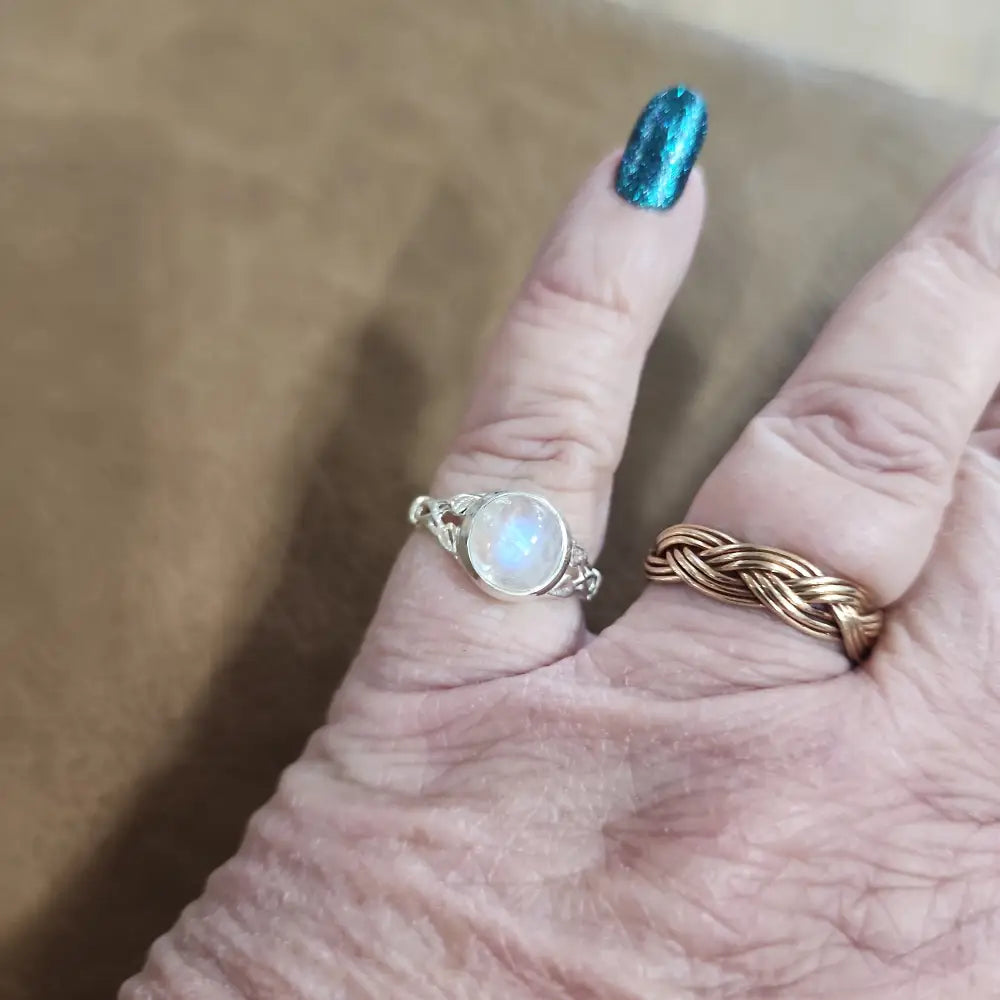 Assorted sterling silver rings featuring unique genuine gemstones in various shapes and colors, displayed on a white background. Perfect for crystal energy, personal style, and one-of-a-kind magic.