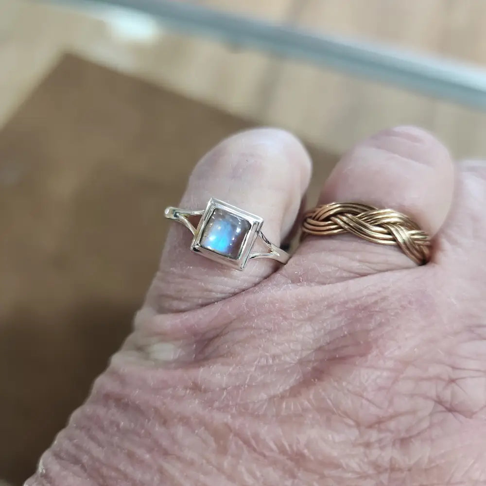 Assorted sterling silver rings featuring unique genuine gemstones in various shapes and colors, displayed on a white background. Perfect for crystal energy, personal style, and one-of-a-kind magic.