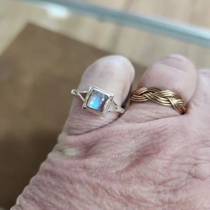 Assorted sterling silver rings featuring unique genuine gemstones in various shapes and colors, displayed on a white background. Perfect for crystal energy, personal style, and one-of-a-kind magic.