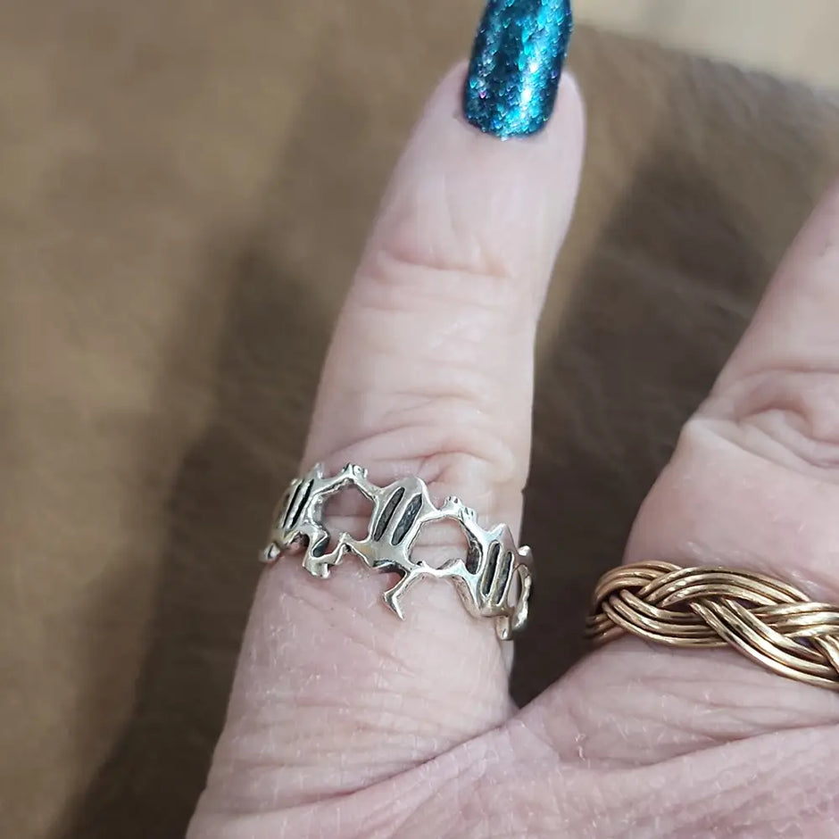 Assorted sterling silver rings featuring unique genuine gemstones in various shapes and colors, displayed on a white background. Perfect for crystal energy, personal style, and one-of-a-kind magic.