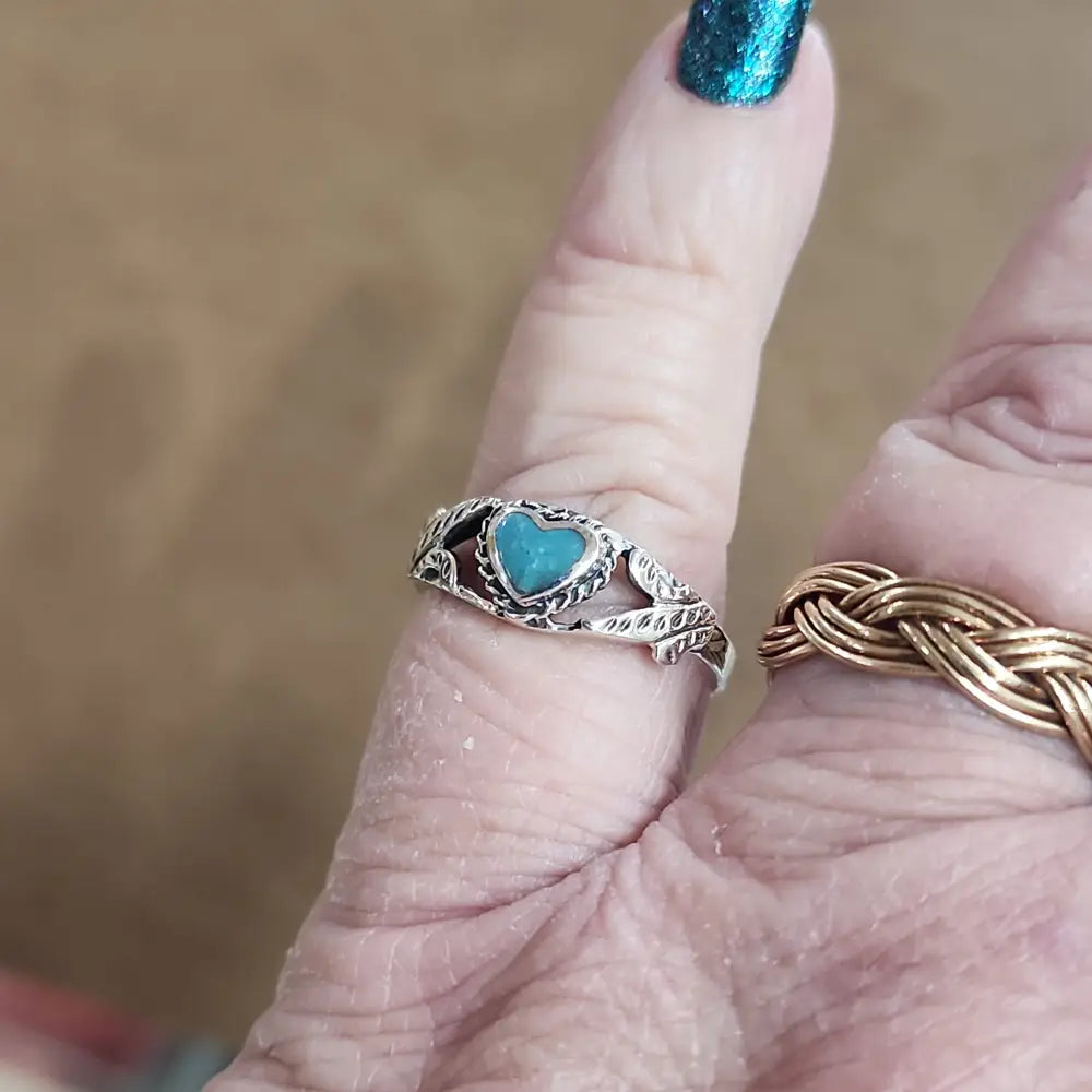 Assorted sterling silver rings featuring unique genuine gemstones in various shapes and colors, displayed on a white background. Perfect for crystal energy, personal style, and one-of-a-kind magic.