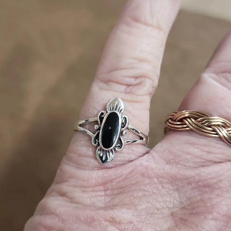 Assorted sterling silver rings featuring unique genuine gemstones in various shapes and colors, displayed on a white background. Perfect for crystal energy, personal style, and one-of-a-kind magic.