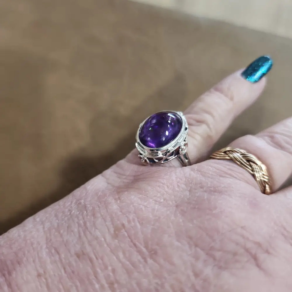 Assorted sterling silver rings featuring unique genuine gemstones in various shapes and colors, displayed on a white background. Perfect for crystal energy, personal style, and one-of-a-kind magic.