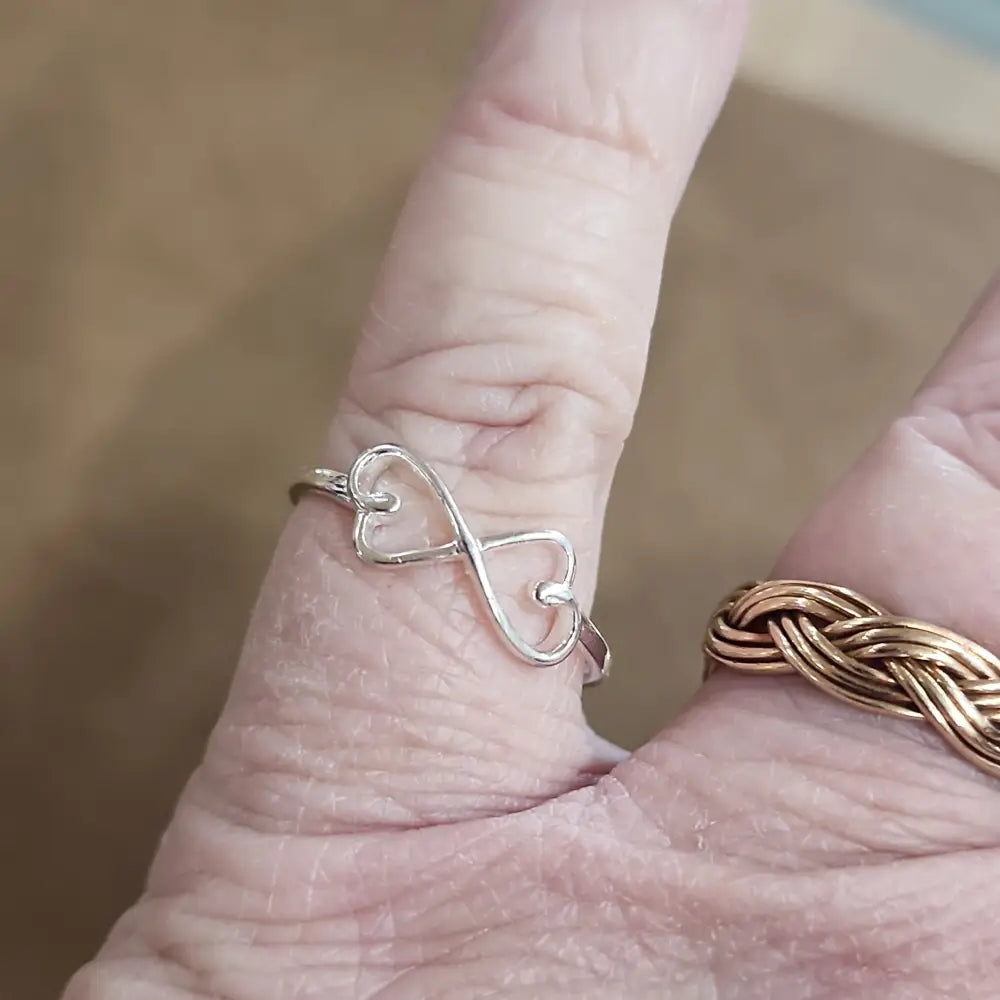 Assorted sterling silver rings featuring unique genuine gemstones in various shapes and colors, displayed on a white background. Perfect for crystal energy, personal style, and one-of-a-kind magic.