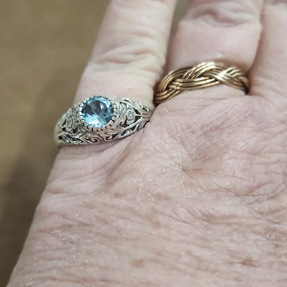 Assorted sterling silver rings featuring unique genuine gemstones in various shapes and colors, displayed on a white background. Perfect for crystal energy, personal style, and one-of-a-kind magic.