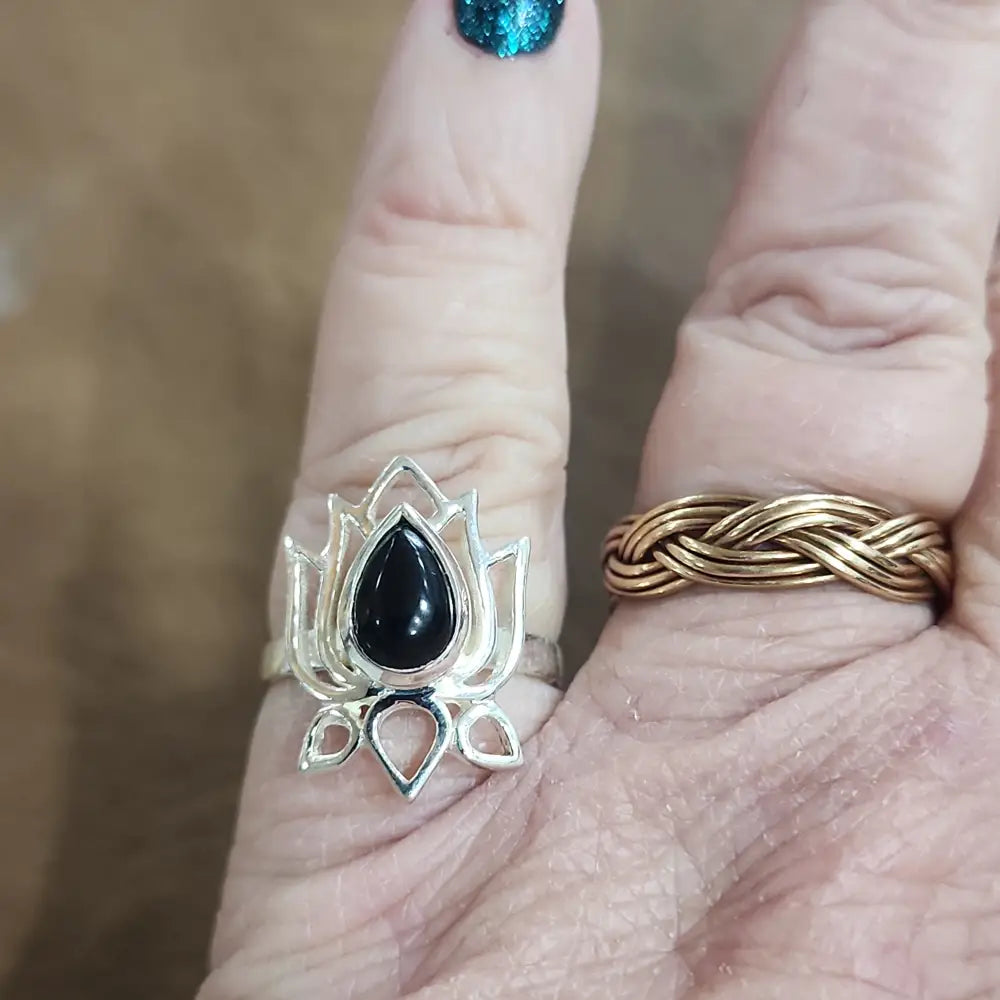 Assorted sterling silver rings featuring unique genuine gemstones in various shapes and colors, displayed on a white background. Perfect for crystal energy, personal style, and one-of-a-kind magic.