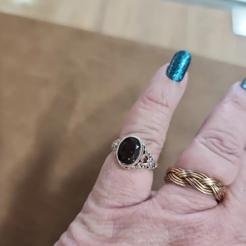 Assorted sterling silver rings featuring unique genuine gemstones in various shapes and colors, displayed on a white background. Perfect for crystal energy, personal style, and one-of-a-kind magic.