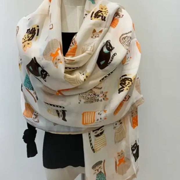 Scarf with cat pattern on a mannequin against a white background